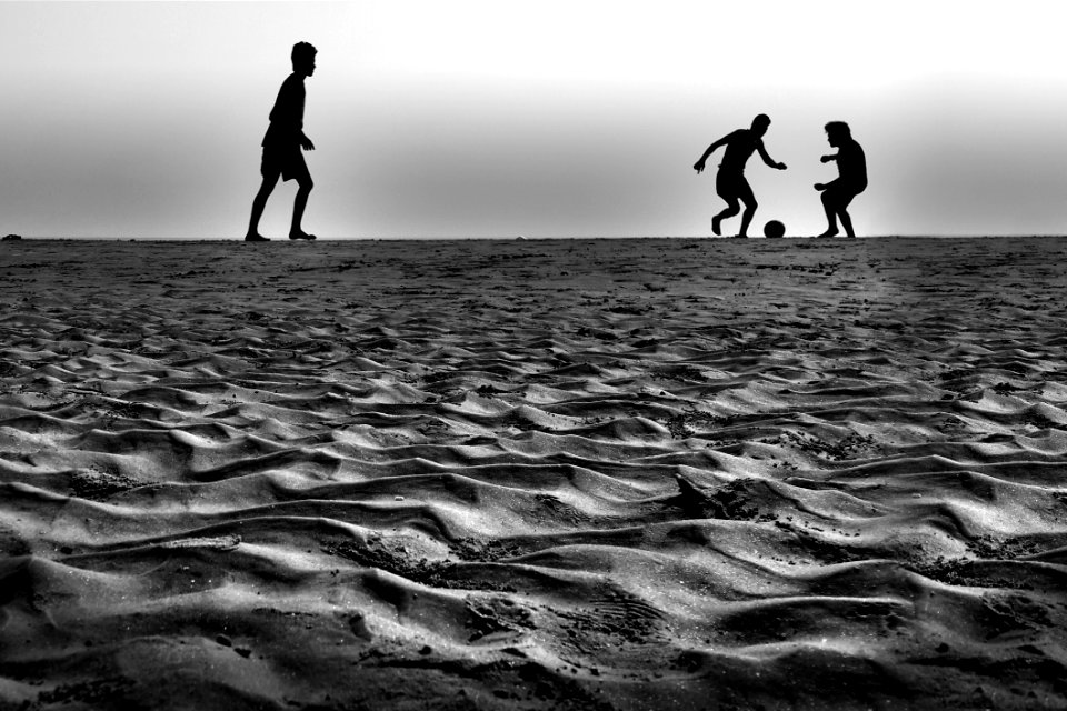 People Playing Ball In Grey Sound