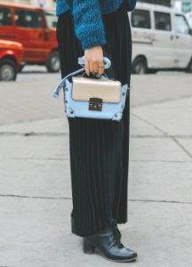 Woman Wearing Blue Leather Purse photo