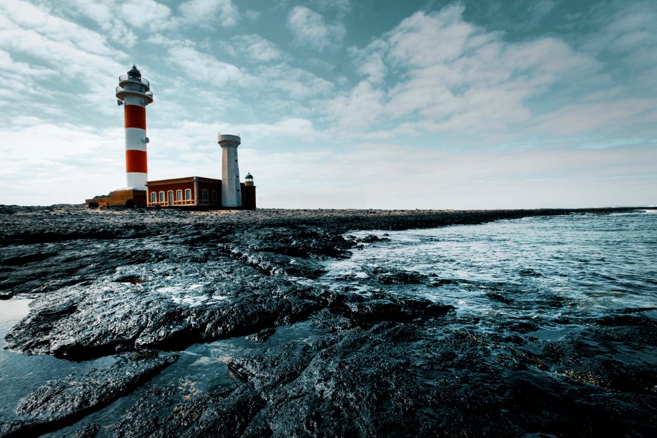 Red And White Lighthouse On Land