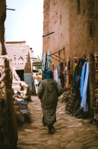 Photo Of A Woman Passing Through The Alley photo