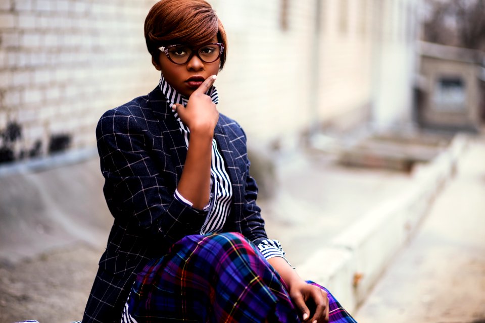 Photo Of Woman Holding Her Lips While Sitting