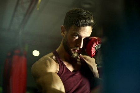 Close-up Photography Of Man Wearing Boxing Gloves photo