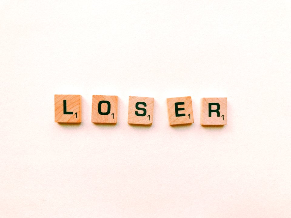 Closeup Photography Of Loser Scrabble Letter