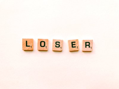 Closeup Photography Of Loser Scrabble Letter photo