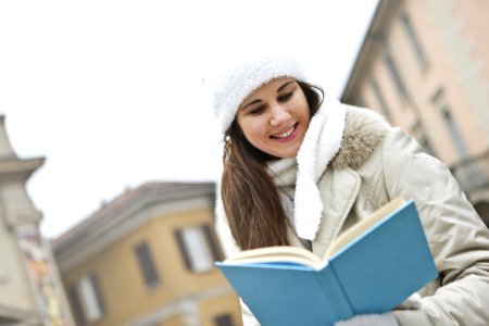Woman In Gray Coat And White Cap