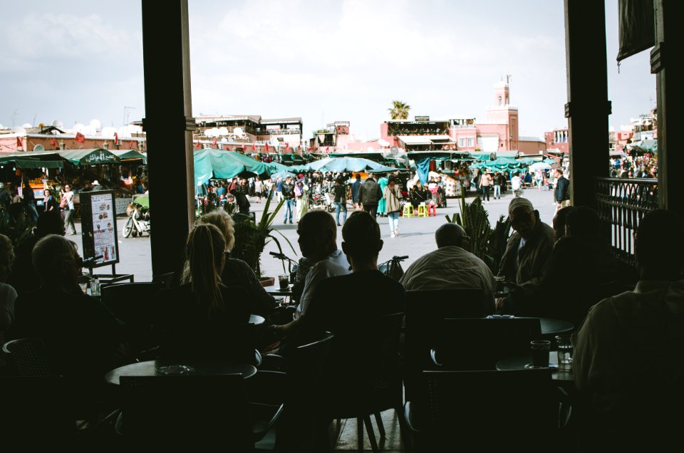 Silhouette Photo Of People Sitting On Chairs