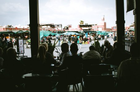 Silhouette Photo Of People Sitting On Chairs