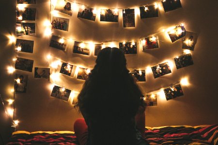 Woman Watching Photo Collection With String Lights photo
