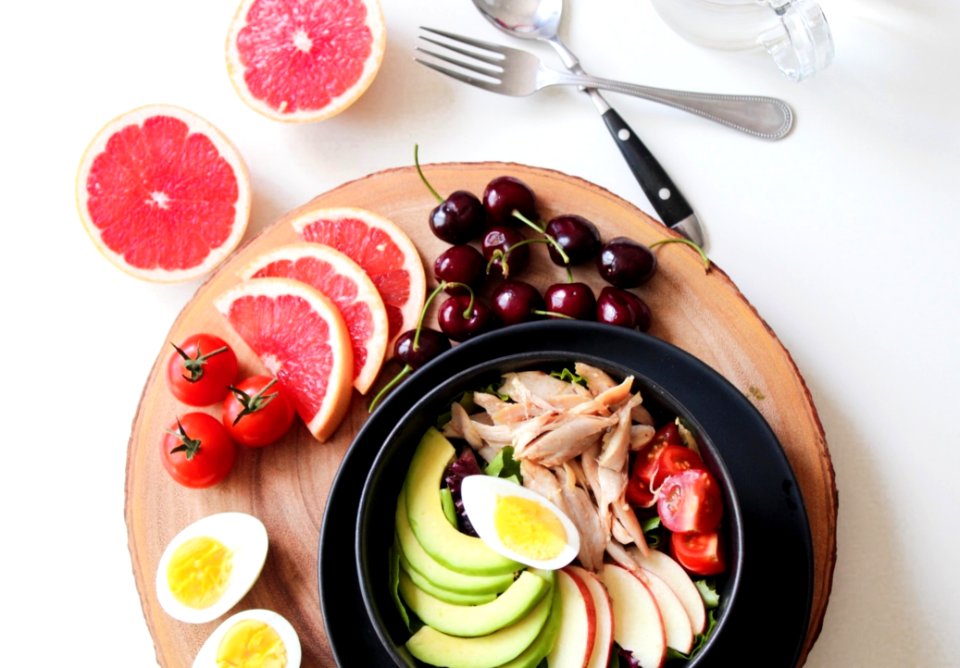 Bowl Of Vegetable Salad And Fruits