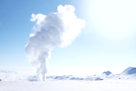 Smoke Rising From Snow-covered Field photo