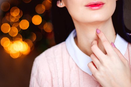 Woman Touching Neck photo