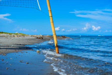 Closeup Photo Of Brown Bamboo Beach Volleyball Post Near Shoreline