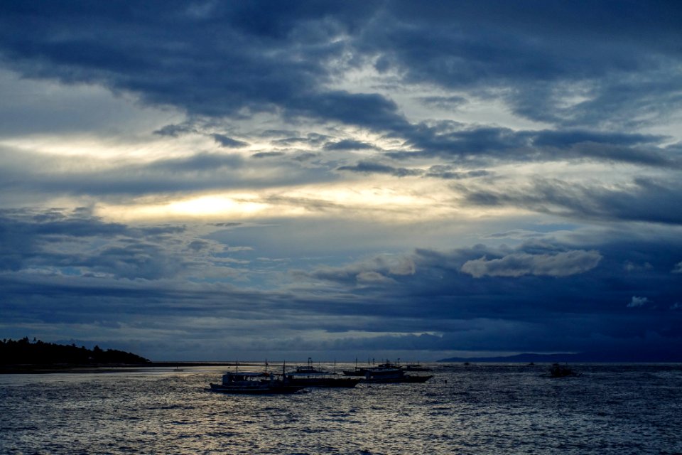 Ships On Body Of Water During Cloudy Daytime