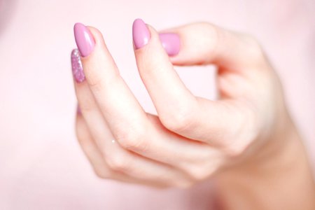 Persons Hand With Pink Manicure