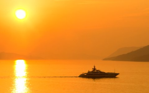 Sailing Cruise Ship During Yellow Sunset