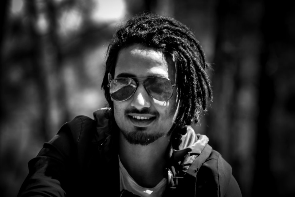 Grayscale Photography Of Man Wearing Sunglasses