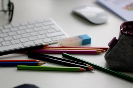 Shallow Focus Photography Of Assorted Pencils Near Apple Keyboard And Mouse