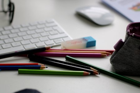 Shallow Focus Photography Of Assorted Pencils Near Apple Keyboard And Mouse photo