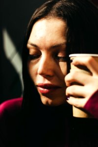 Woman Holding Brown Cup photo