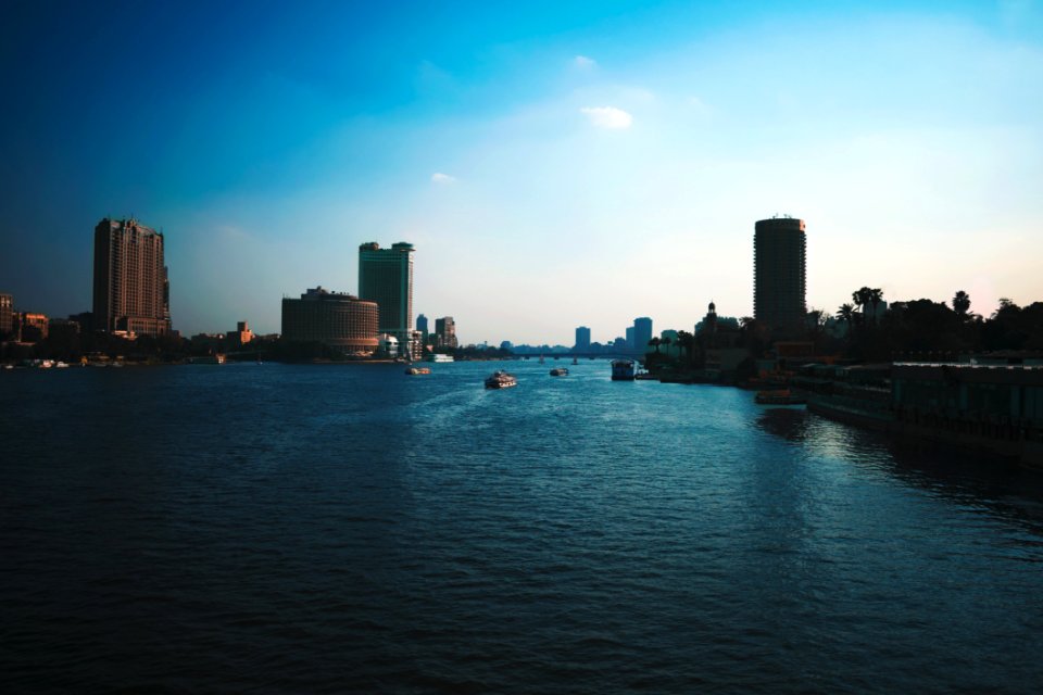Boats On Water With High Rise Building Background