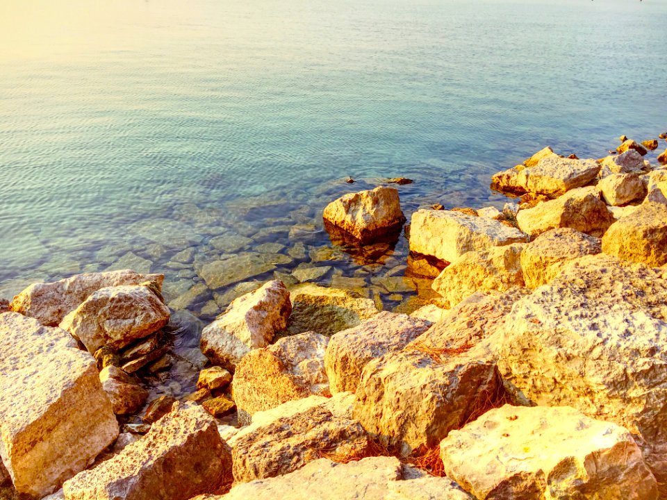 Photo Of Boulders Near Body Of Water photo