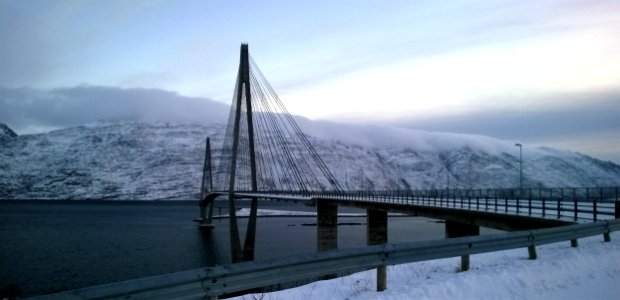 Black Suspension Bridge Under Cumulus Clouds