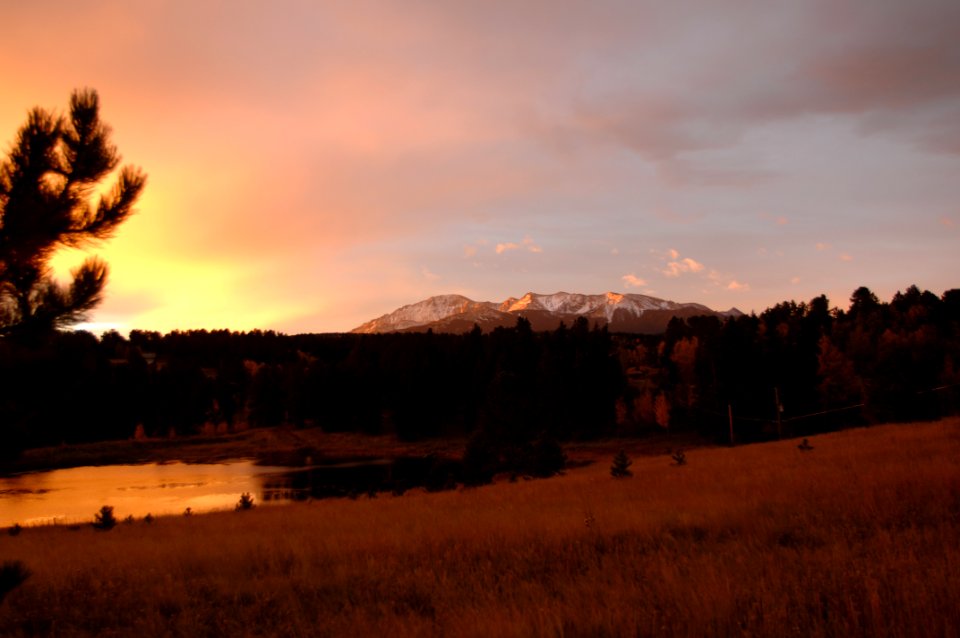 Silhouette Photo Of Grass Field With Body Of Water And Mountains