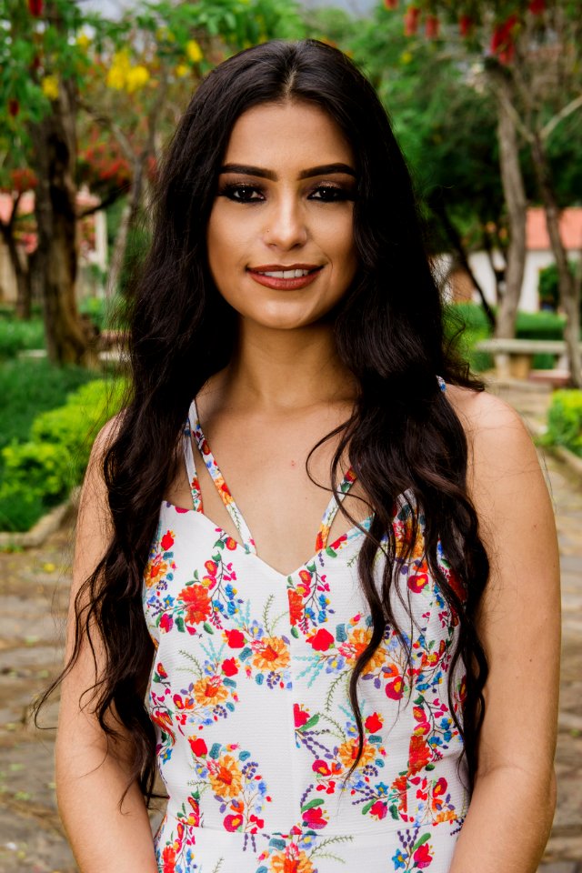 Woman Wearing White And Multicolored Floral Sleeveless Top photo