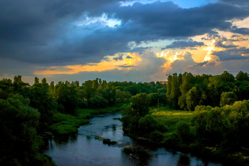 Photo Of River Between Green Grass Fields