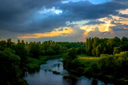 Photo Of River Between Green Grass Fields photo