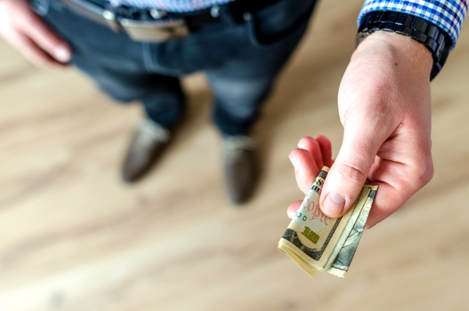 Person Holding Banknote