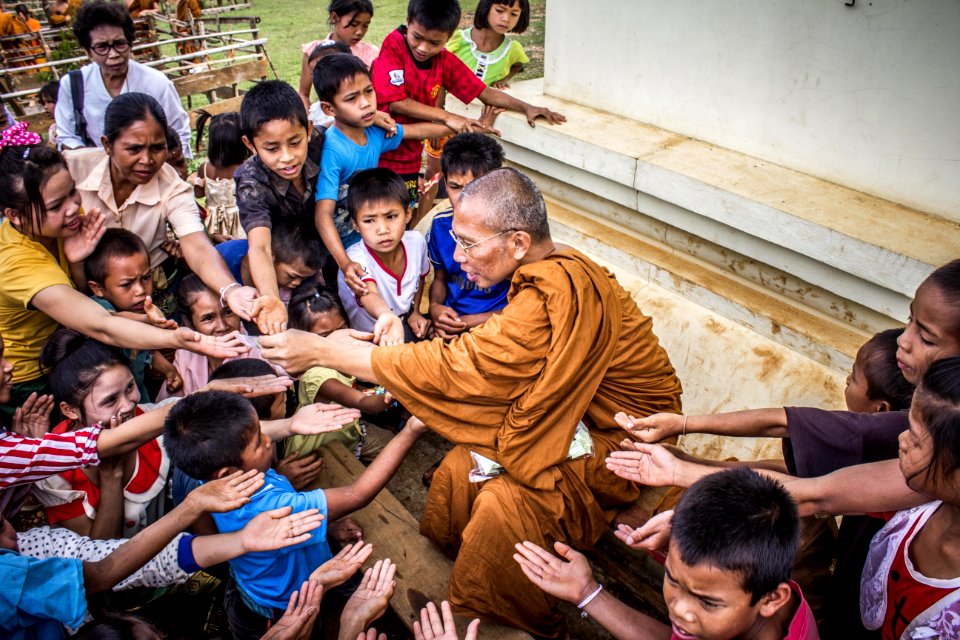 Monk Surrounded By Children