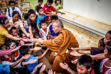 Monk Surrounded By Children