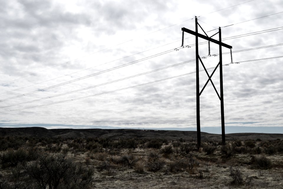 Photograph Of Electrical Post On Cloudy Day