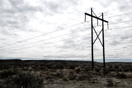 Photograph Of Electrical Post On Cloudy Day photo