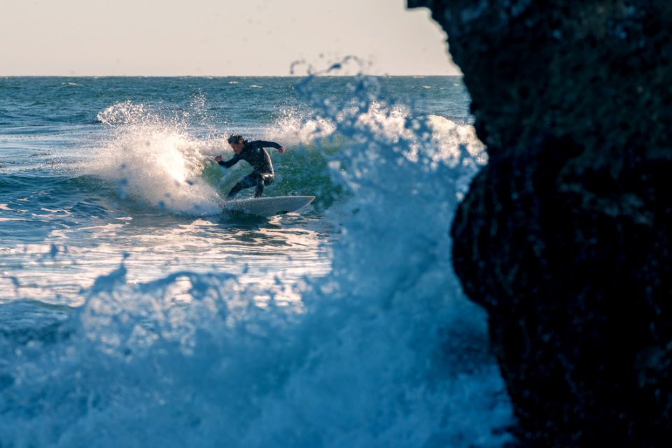 Man Surfing On Body Of Water