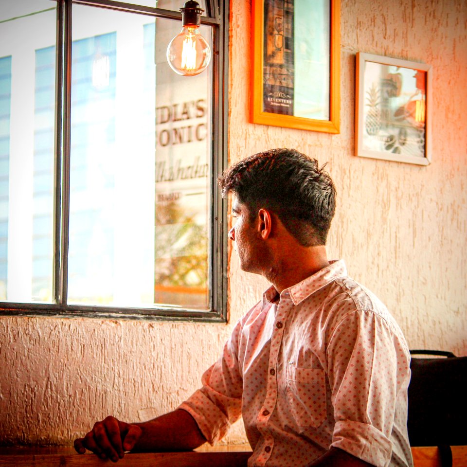 Man Wearing White And Red Dress Shirt Staring Outside Window