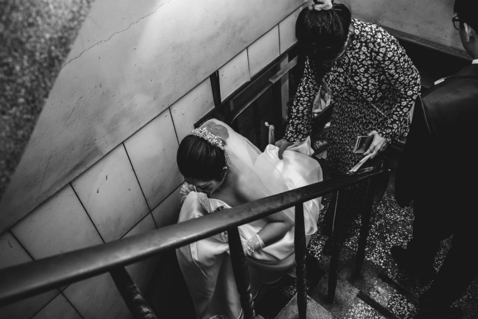 Grayscale Photography Of Bride On Stair photo