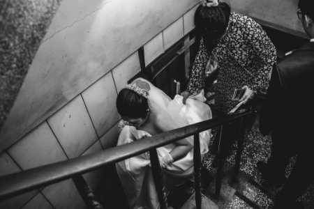 Grayscale Photography Of Bride On Stair photo