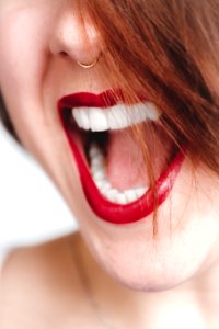 Woman In Red Lipstick Opening Her Mouth photo