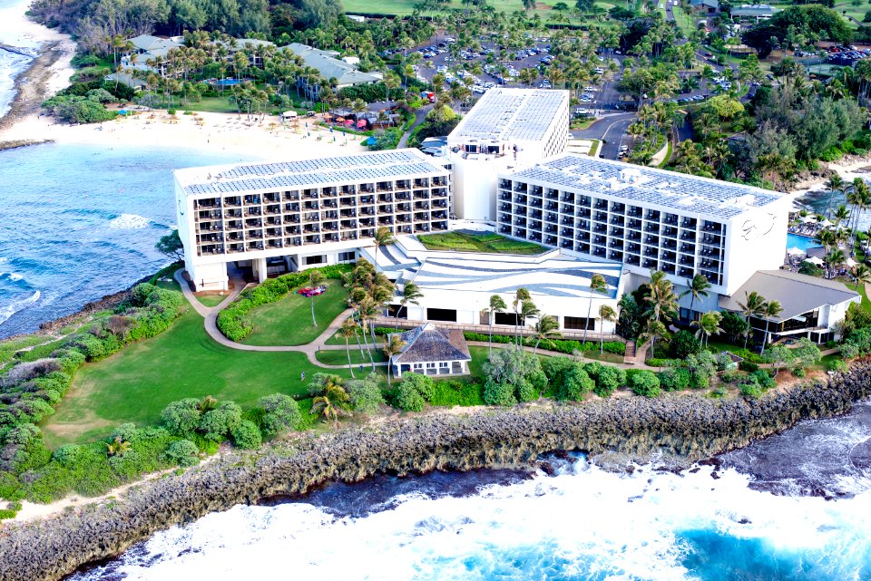 Aerial Photography Of Building Near Cliff Beside Body Of Water