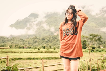 Woman Wearing Orange Long-sleeved Shirt photo