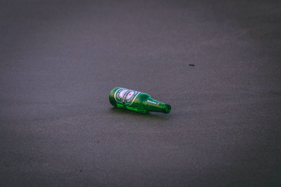 Empty Heineken Bottle On Ground