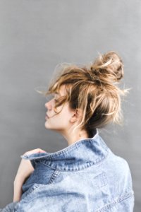 Back View Of Woman Holding Her Denim Jacket photo