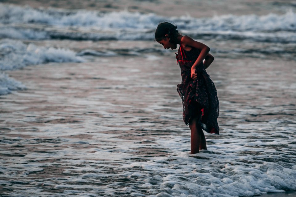 Girl Standing On Seashore