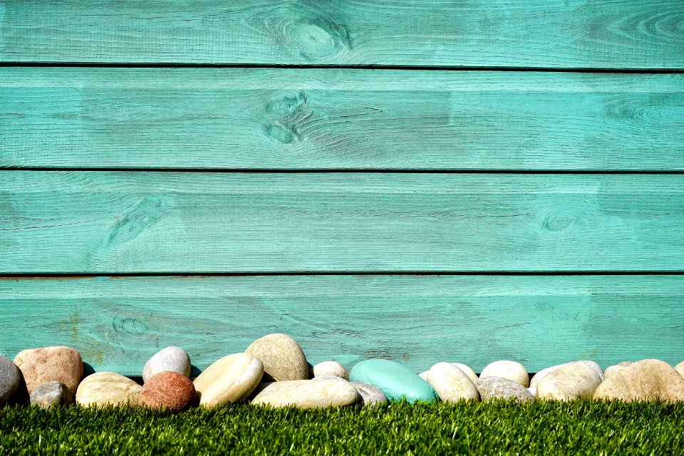 Pile Of White And Blue Stones In Front Blue Painted Wall
