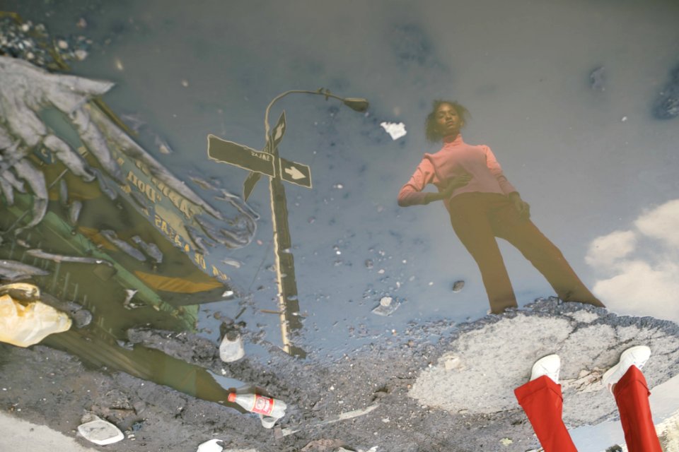 Woman Standing On Ground Surrounded With Water
