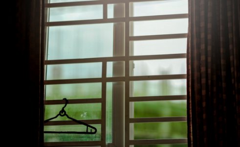 Black Clothes Hanger Hanged On Window