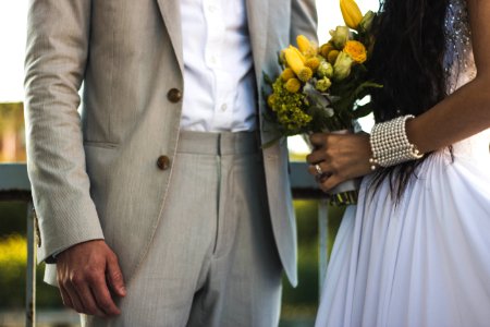 Woman Wearing White Dress And Holding Bouquet photo