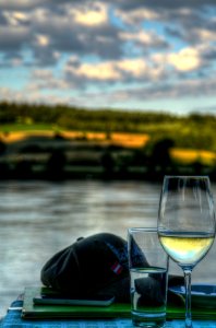 Clear Wine Glass Near Baseball Cap